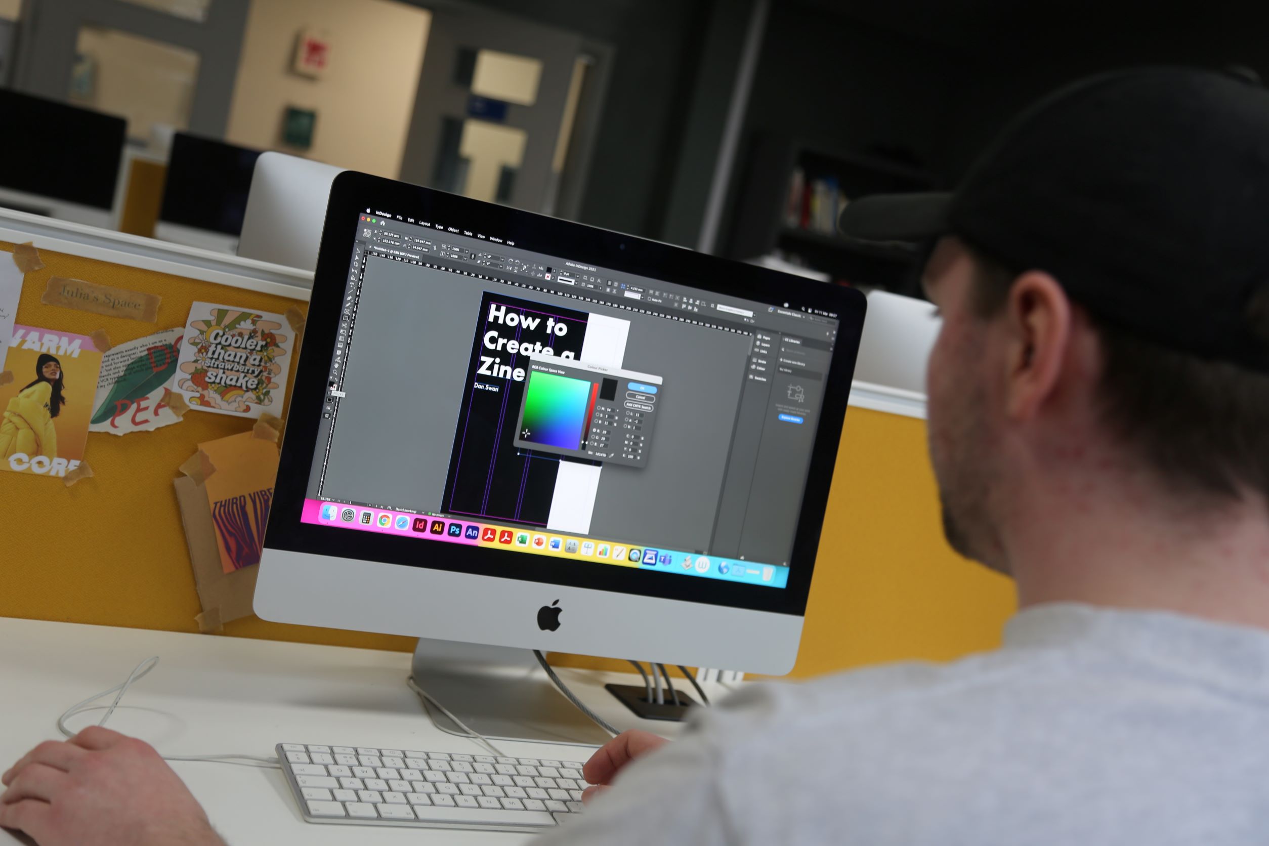 Dan designing a graphic using iMac computer