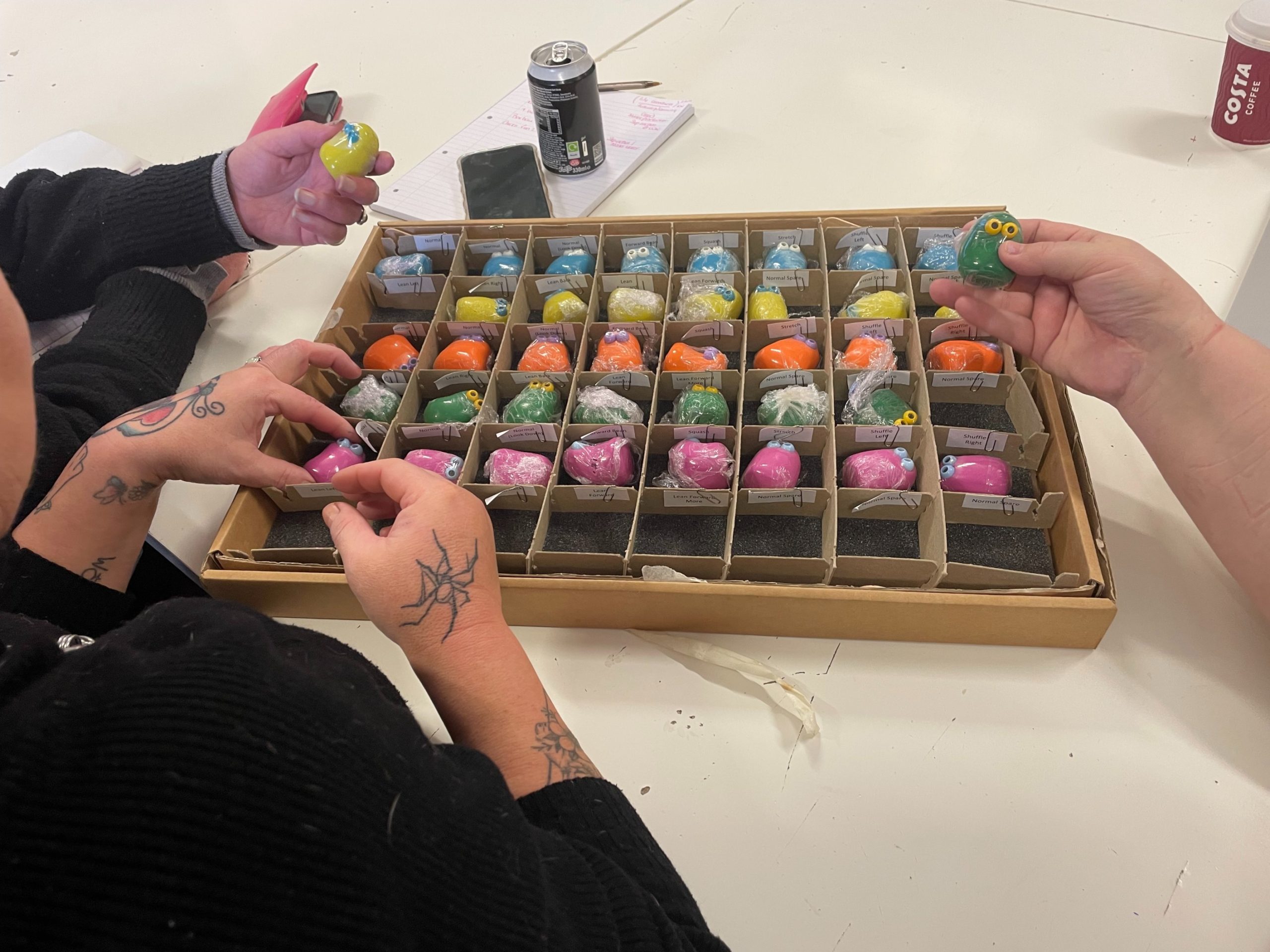 Students looking at the Very Small Creature models