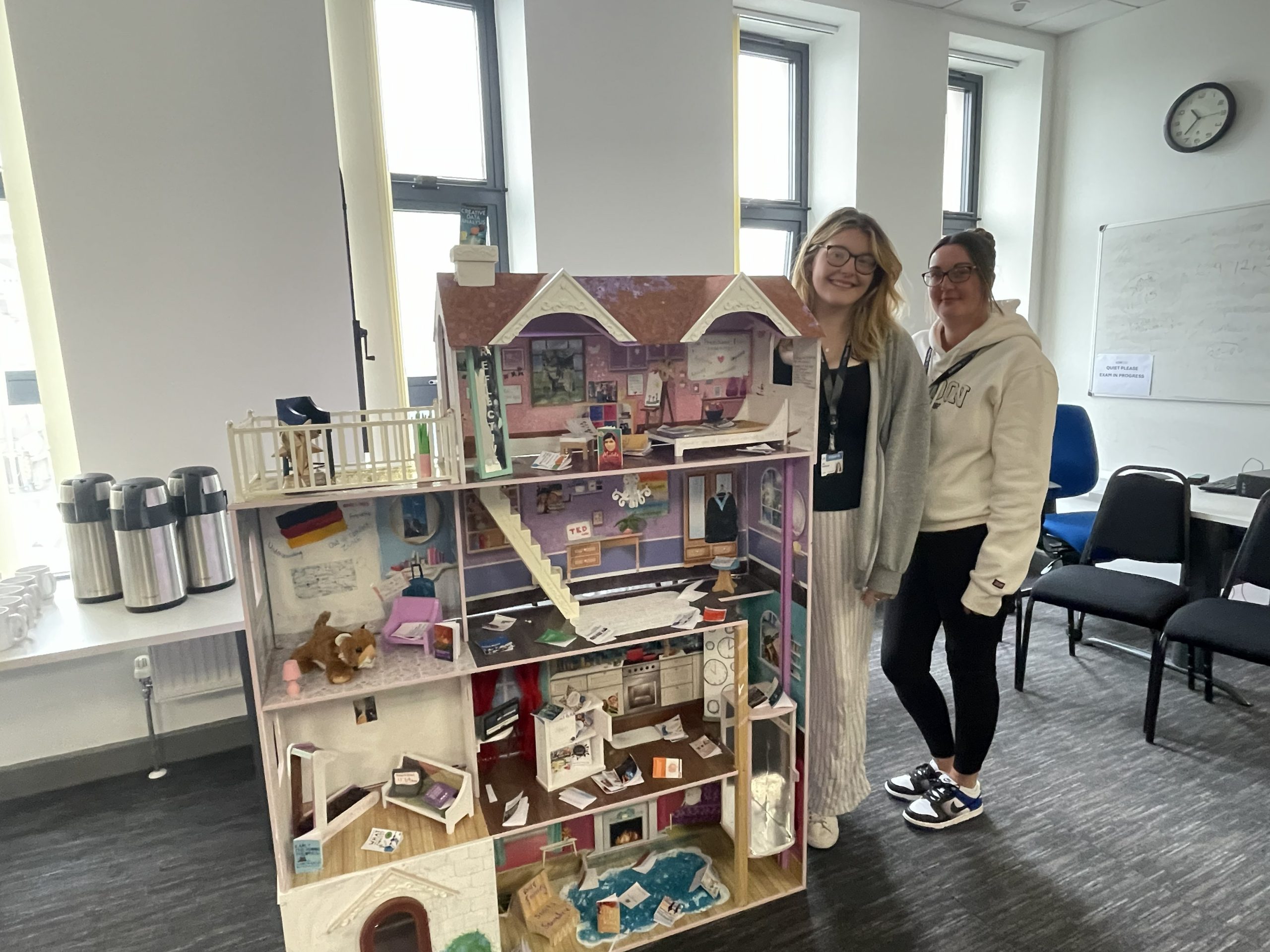 UCW students standing by their work