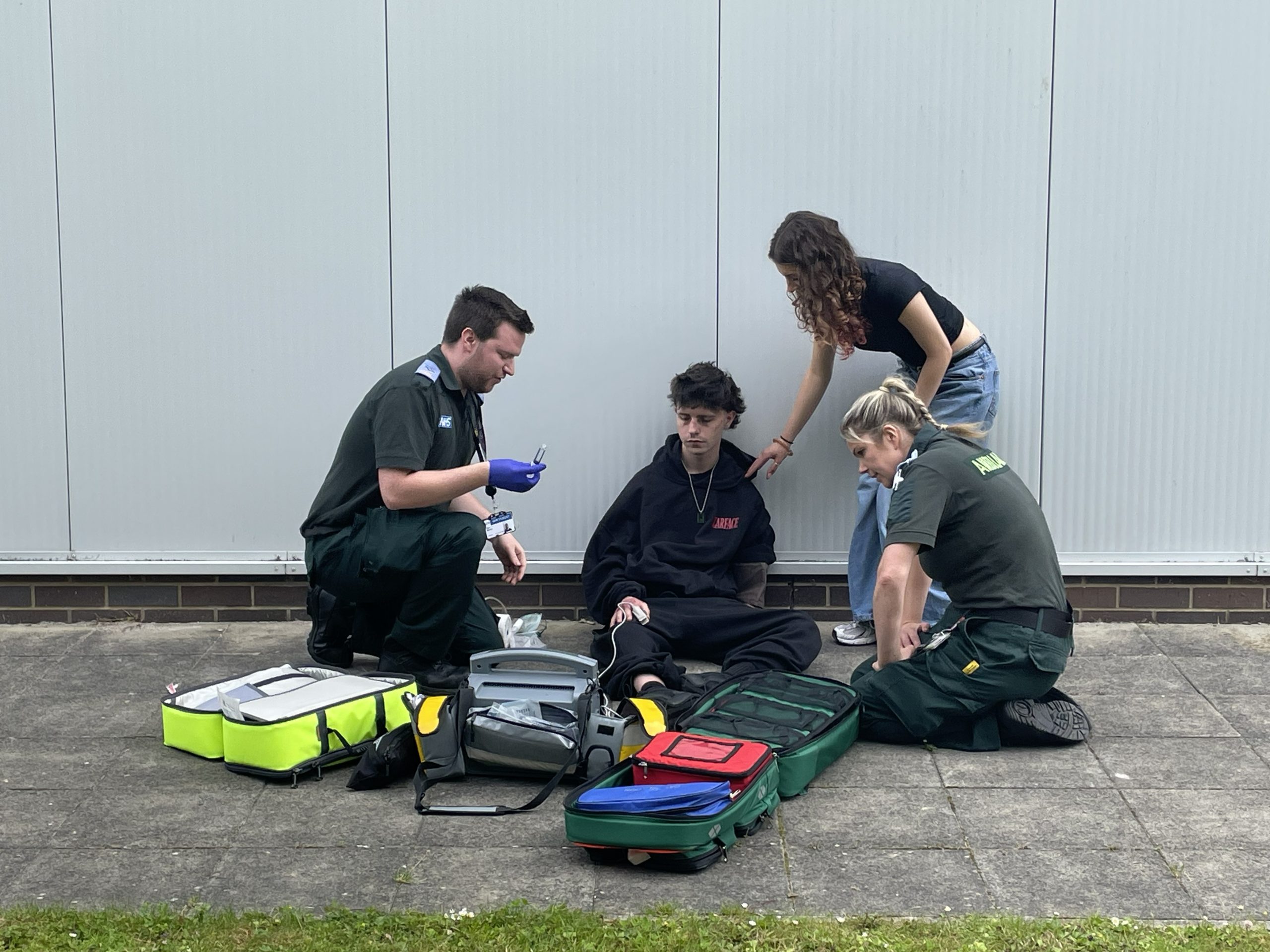 Paramedics attending a simulated emergency