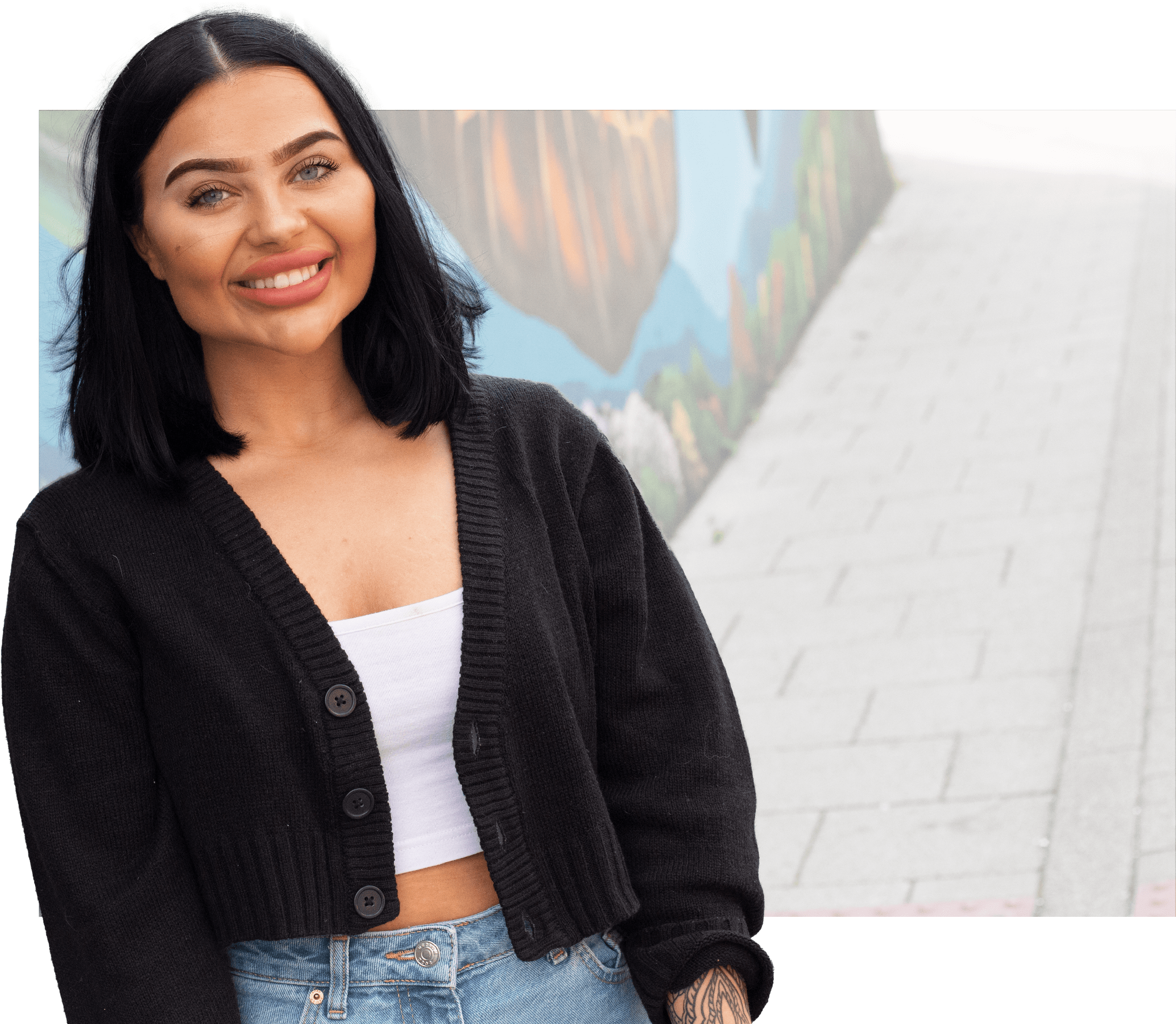 Female Media student smiling at camera with Photoshopped background