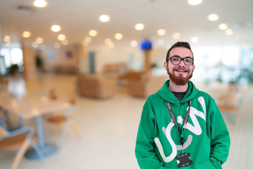 Male Business and Professional Studies student smiling at the camera