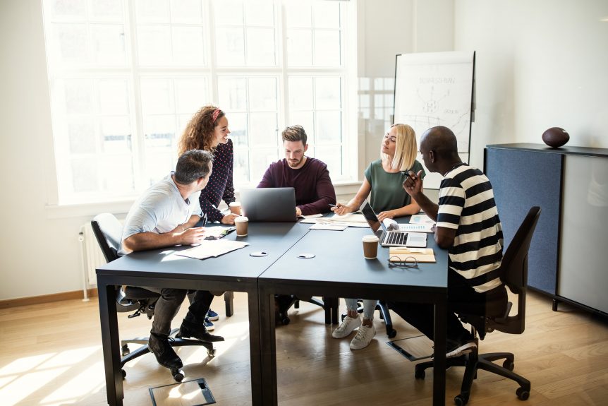 a group working on a project together in an office