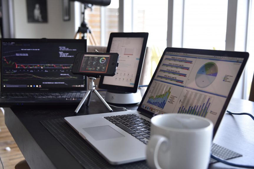 laptop computers tablet and smart phones showing data charts graphs