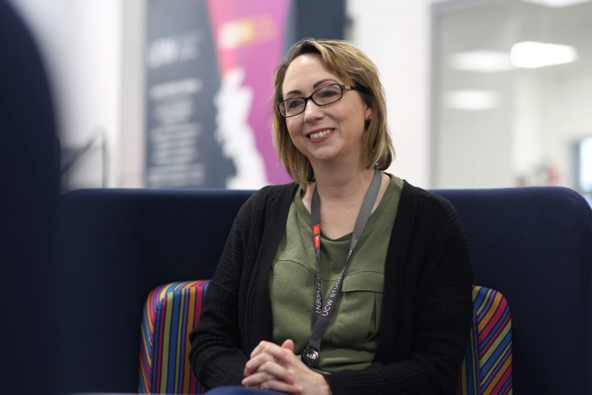 Early Years Degree student sitting in UCW smiling