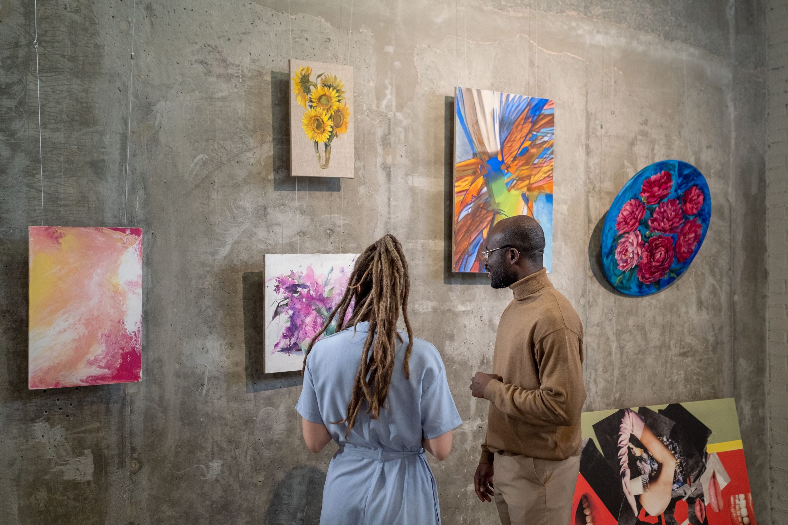 young intercultural man and woman discussing art