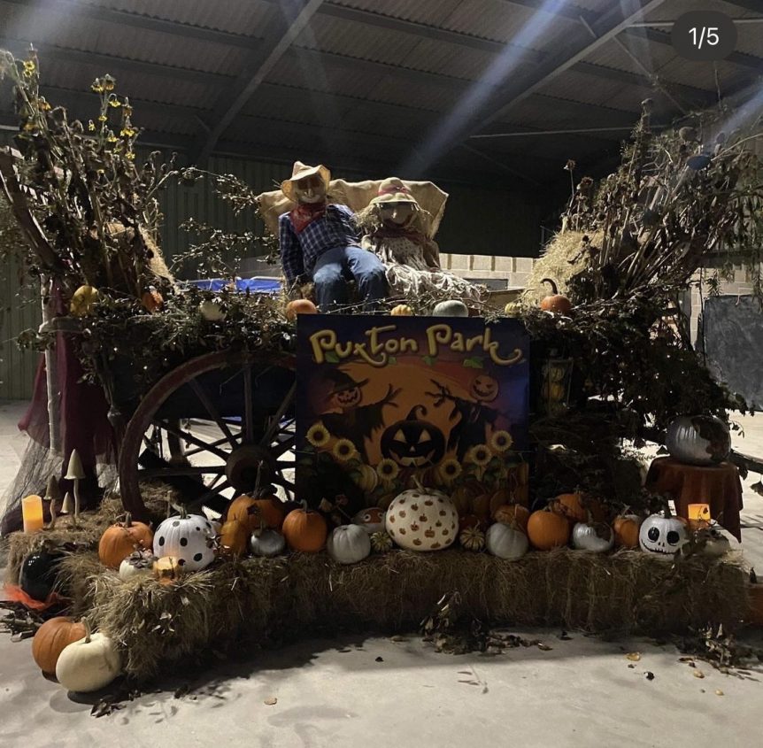 Sign for Puxton Park Phobia Halloween event surrounded by pumpkins, scarecrows and Halloween decorations