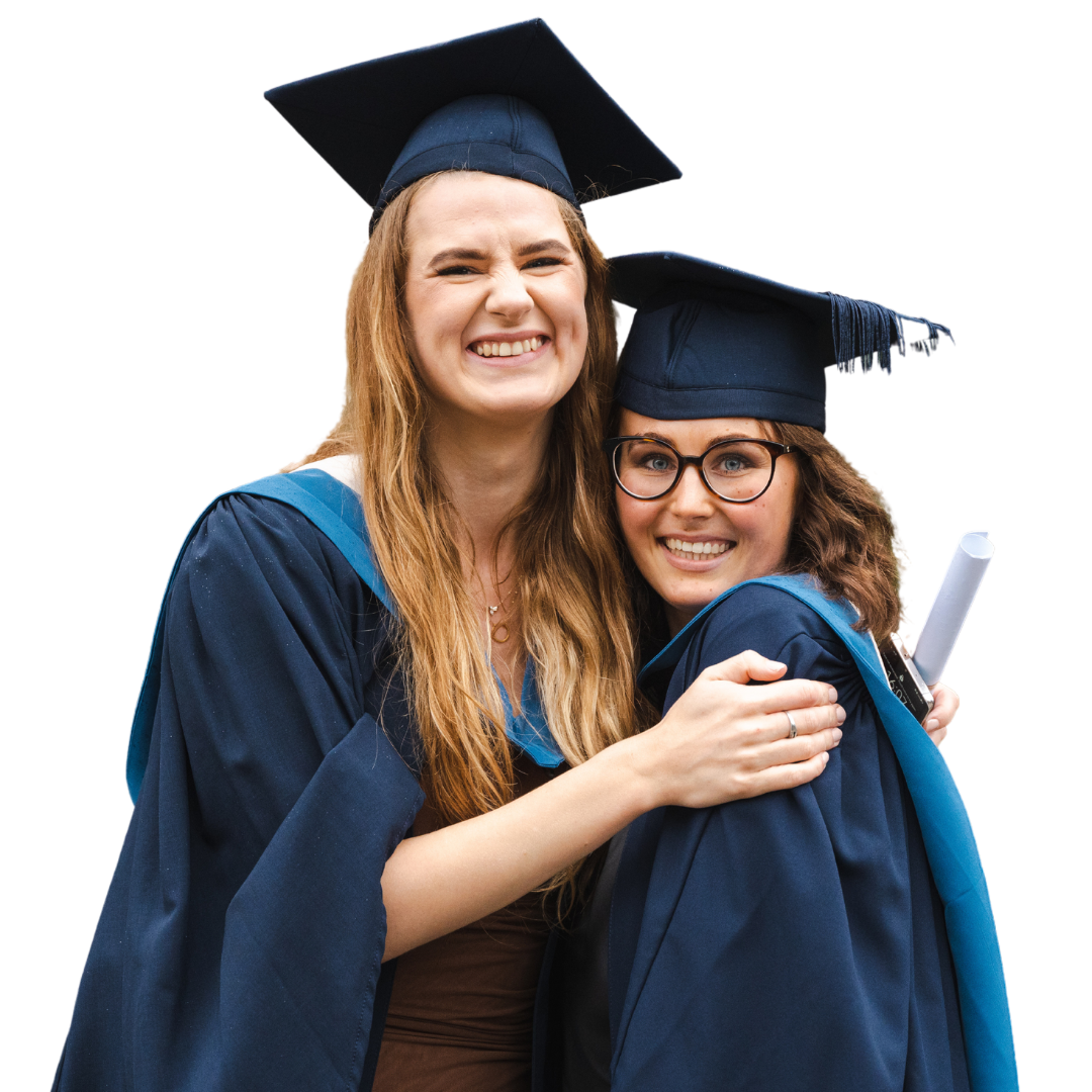 two female students embracing at graduation at university centre weston