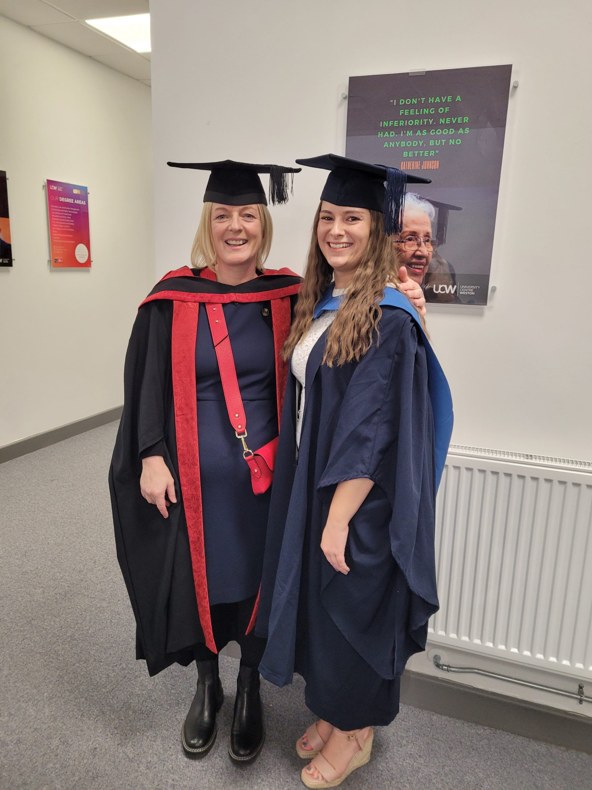 chelsea porter in a graduation gown with her UCW lecturer.
