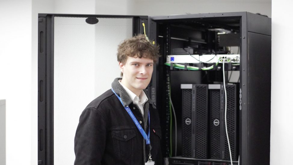 Jack Cole standing in front of a server