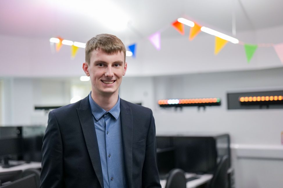 Jack in a suit smiling