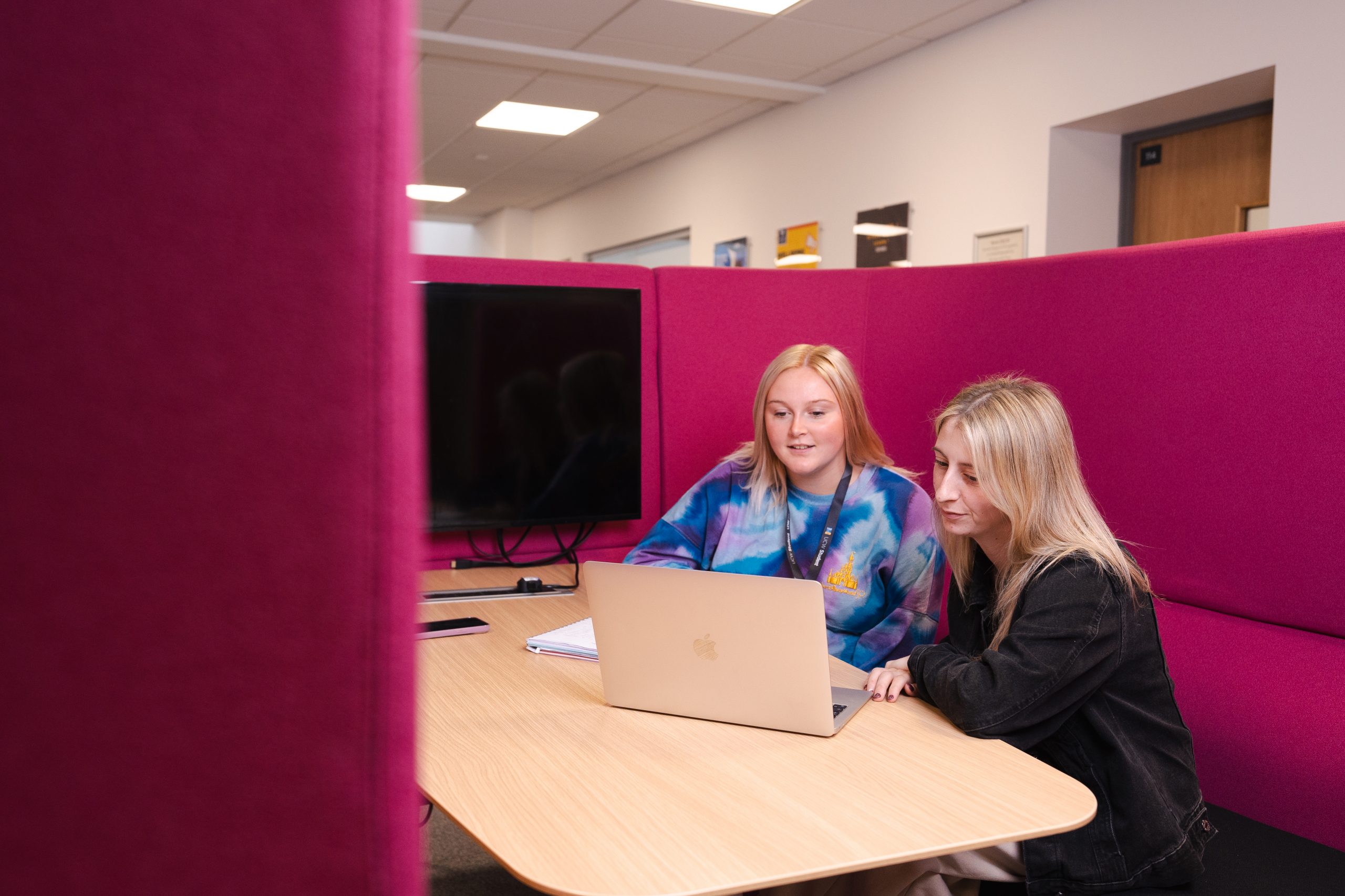 Lecturer supporting a student