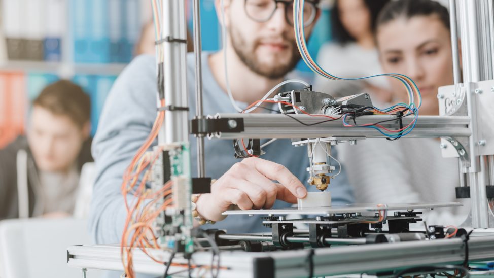 A student using a 3D printer