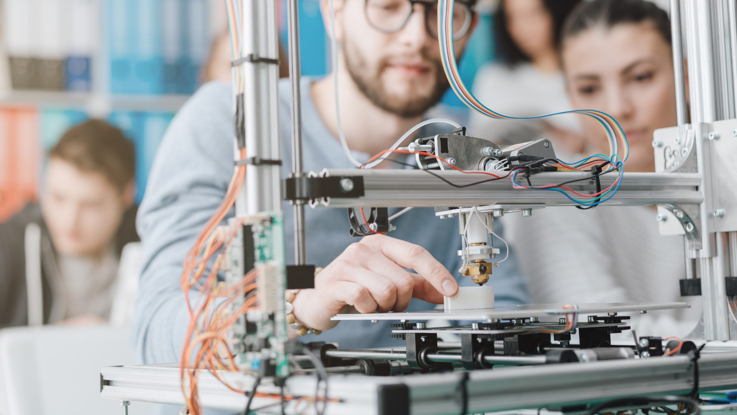 A student using a 3D printer