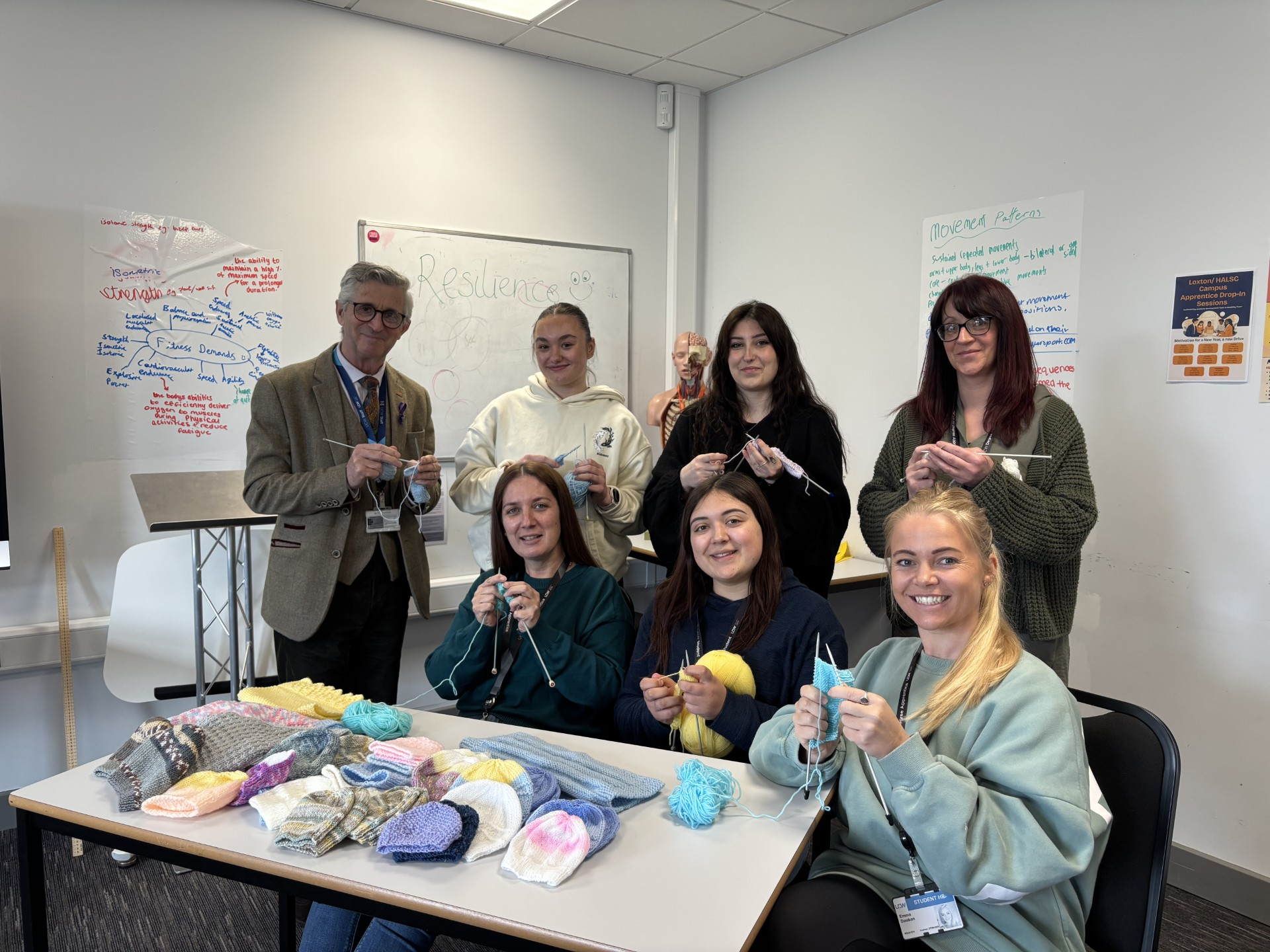 Assistant Practitioner Students Knitting Hats