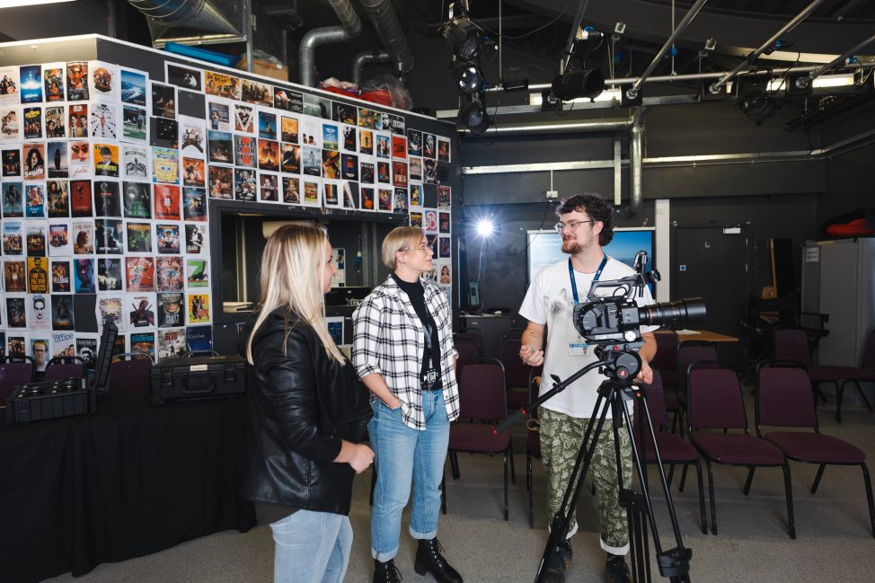 UCW students speaking to a lecturer